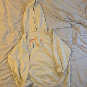 Sweatshirt. Embroidered with “Manifest your dreams” on the back.